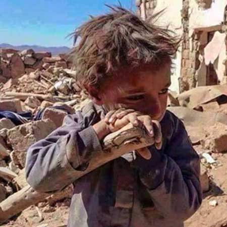 Little Afghan boy crying in war zone