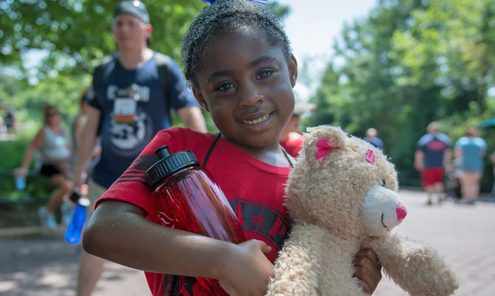 Good Grief Camp - little girl with teddy bear and water bottle