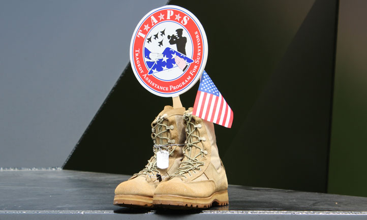 military boots and folded flag