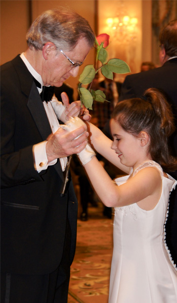 Amy's daughter dancing with grandfather