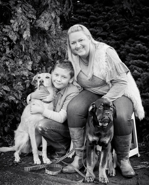 Crystal and her son Max and their foster dogs