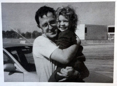 Carolyn Horton as a little girl being held by her father