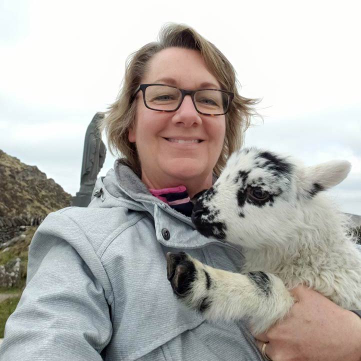 Carole Hilton holding a lamb