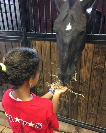 Arianna Bryant visited the stables at Fort Myer