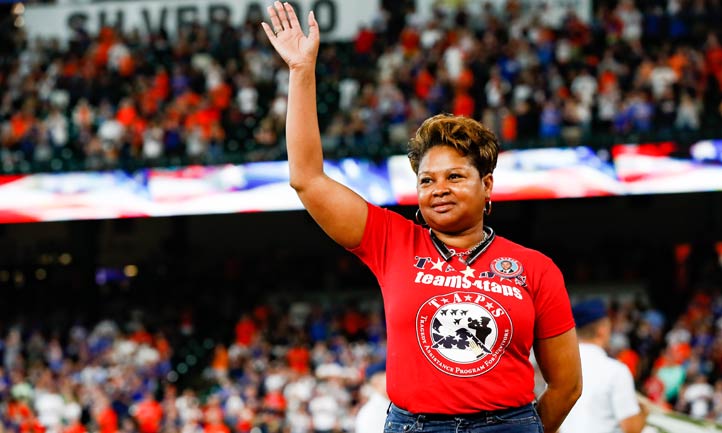Kendra Wilson-Hudson wave to crowd at Houston Astros game
