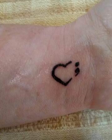 Lydia's broken heart tattoo