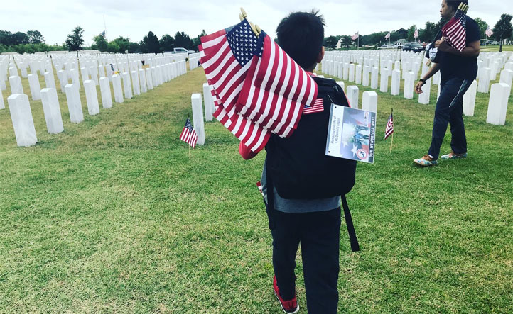 laying flags at cemetery