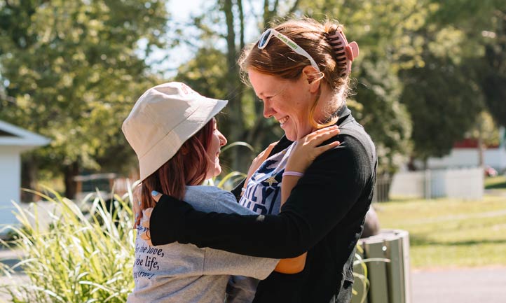 mom and child embrace at TAPS Family Camp