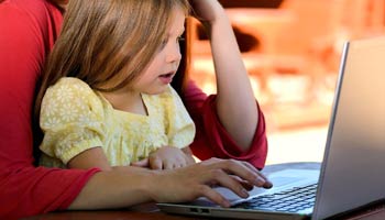 Little girl at computer