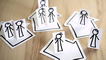 Paper dolls symbolizing isolation