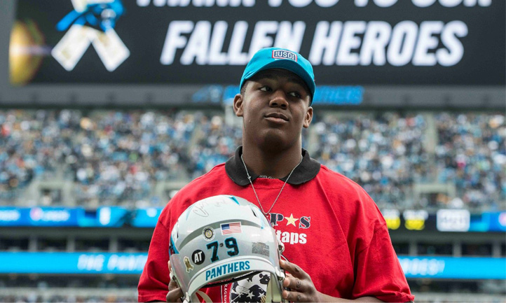 TAPS Teen with Panthers helmet