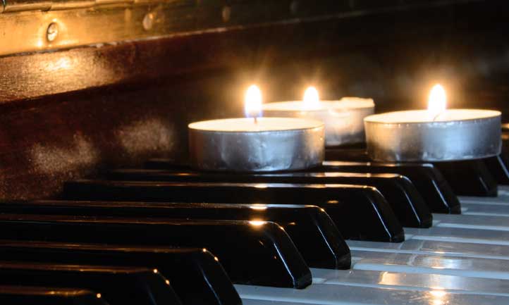 candles on piano keys