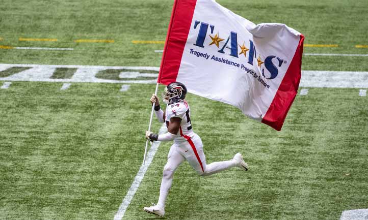 Atlanta Falcon player and TAPS Flag