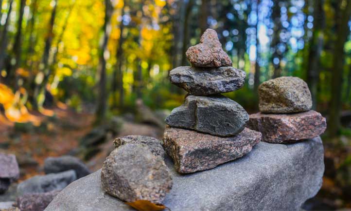 stack of rocks in wooded forest