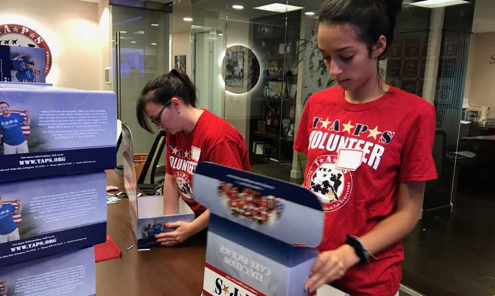 Volunteers put together resource kits at TAPS Headquarters