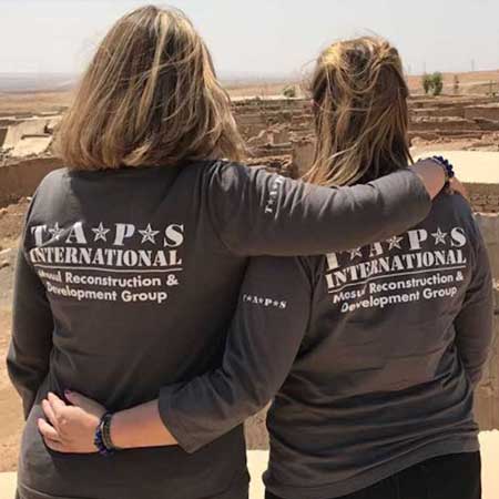 Bonnie Carroll and Erin Jacobson view country side destroyed by war