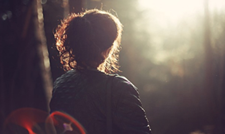 woman looking at sunset