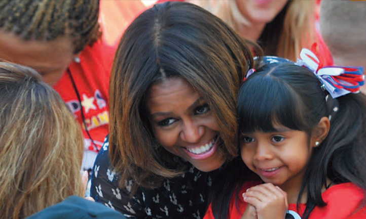 TAPS Magazine summer 2014 cover, Michelle Obama with surviving child