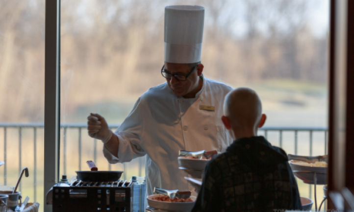 chef dishing up food