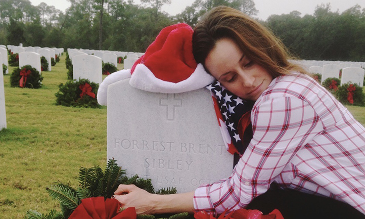Hannah at her boyfriend's grave