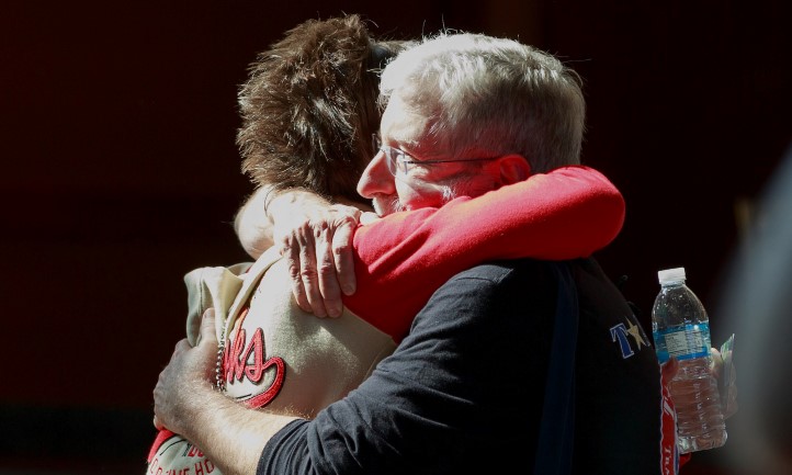 Survivors Hug Each Other