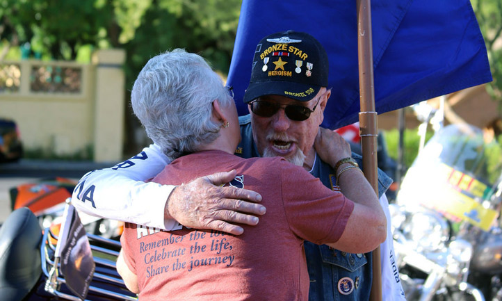Survivor Hugs a Veteran