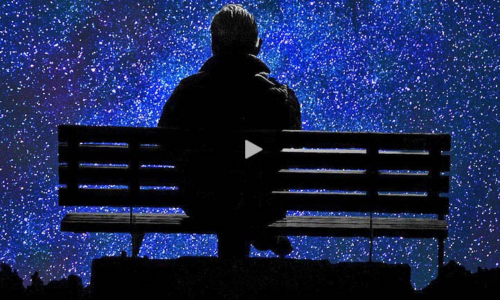 Man looking out a starry night