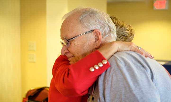 TAPS Peer Mentor and surviving father embrace