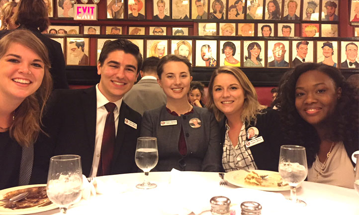 Angel Pansini, center, is shown with other survivors at an event for Legacy Mentors in New York last year.
