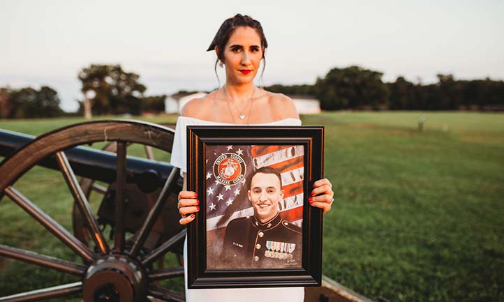 Anna holding photo of her late fiancé