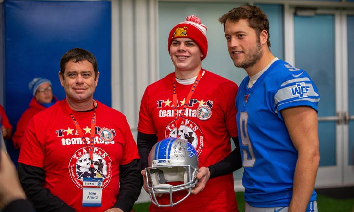 2019: Lions Scholarship Recipient, Kevin Arnold,  With Lions Quarterback Matthew Stafford