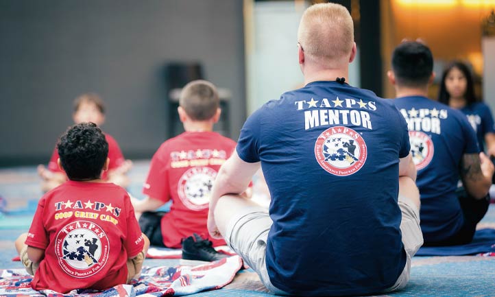 military mentor and good grief camp children doing yoga