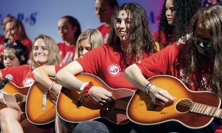 TAPS Survivors playing guitar