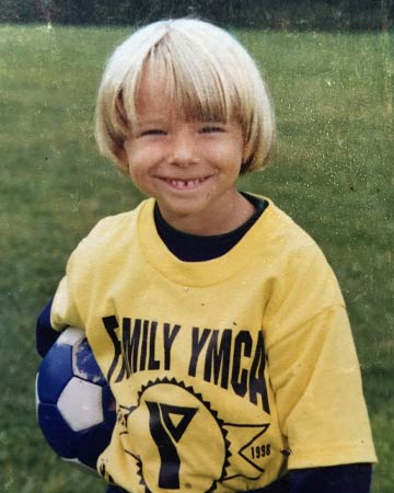 Christopher as a little boy in soccer outfit