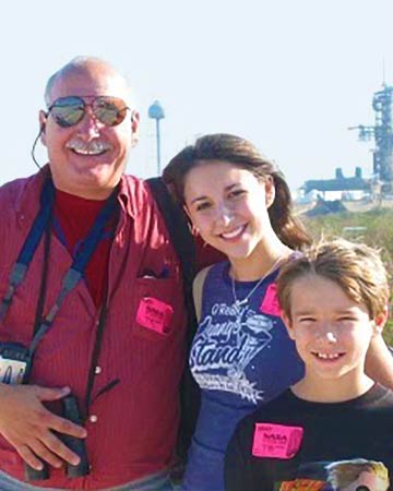 Christopher as a little boy at NASA with dad and sister