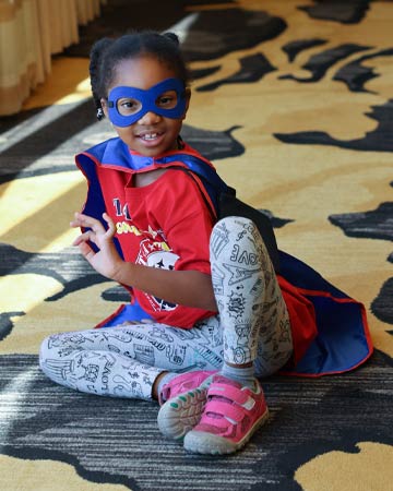 Little girl in Superhero costume