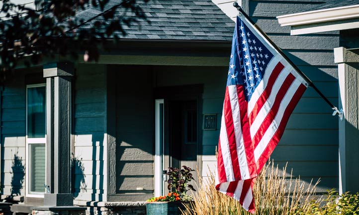 American flag flying on home