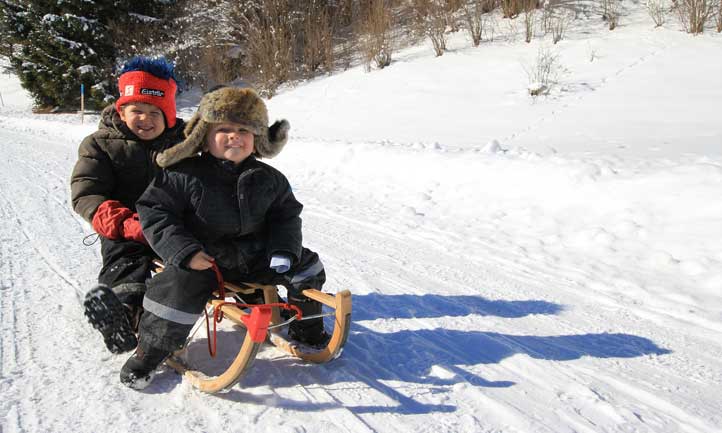 Boys Snow Sledding