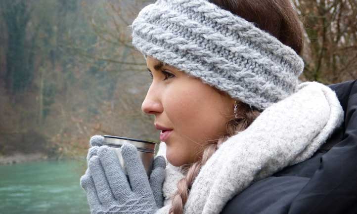 woman with hot drink outside