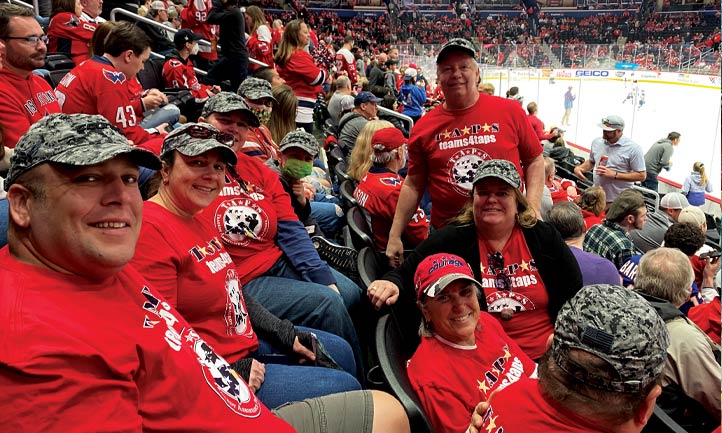 TAPS families enjoy a Washington Capitals game 