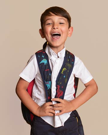 boy with backpack laughing