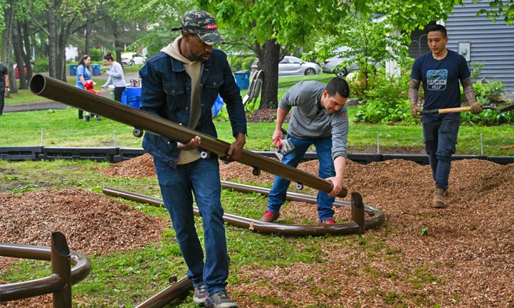 volunteers build playground