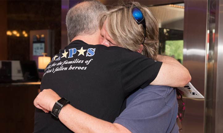 TAPS February Newsletter 2024, TAPS Don Lipstein hugs a Survivor