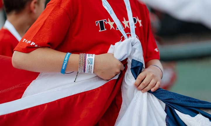 TAPS March Newsletter 2024, TAPS Child holding American Flag