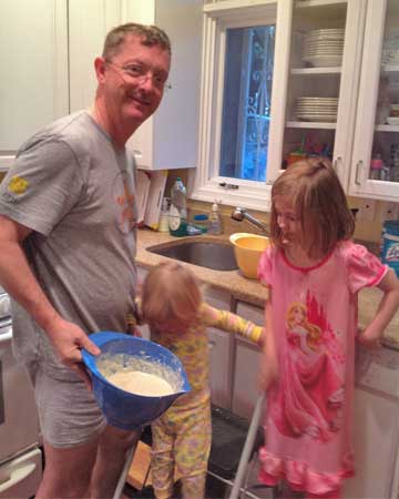 Dave with daughters making pancakes