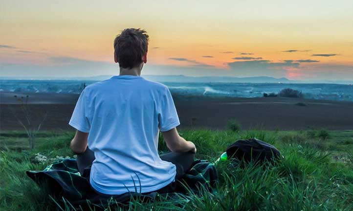 young man meditating