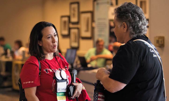 TAPS Staff talking with a military survivor TAPS Staff talking with a military survivor